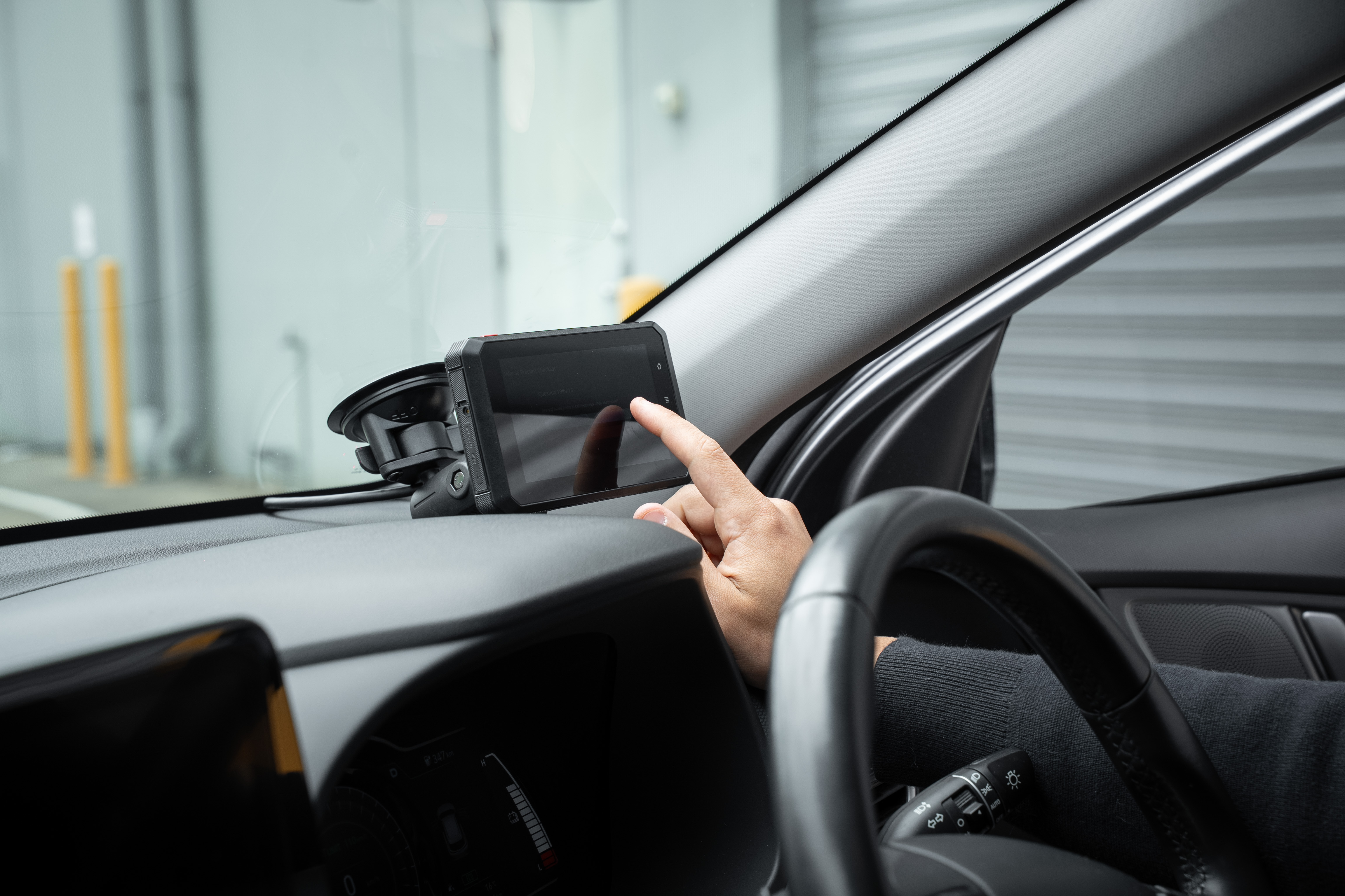 In-cabin Android terminal being used inside a vehicle.