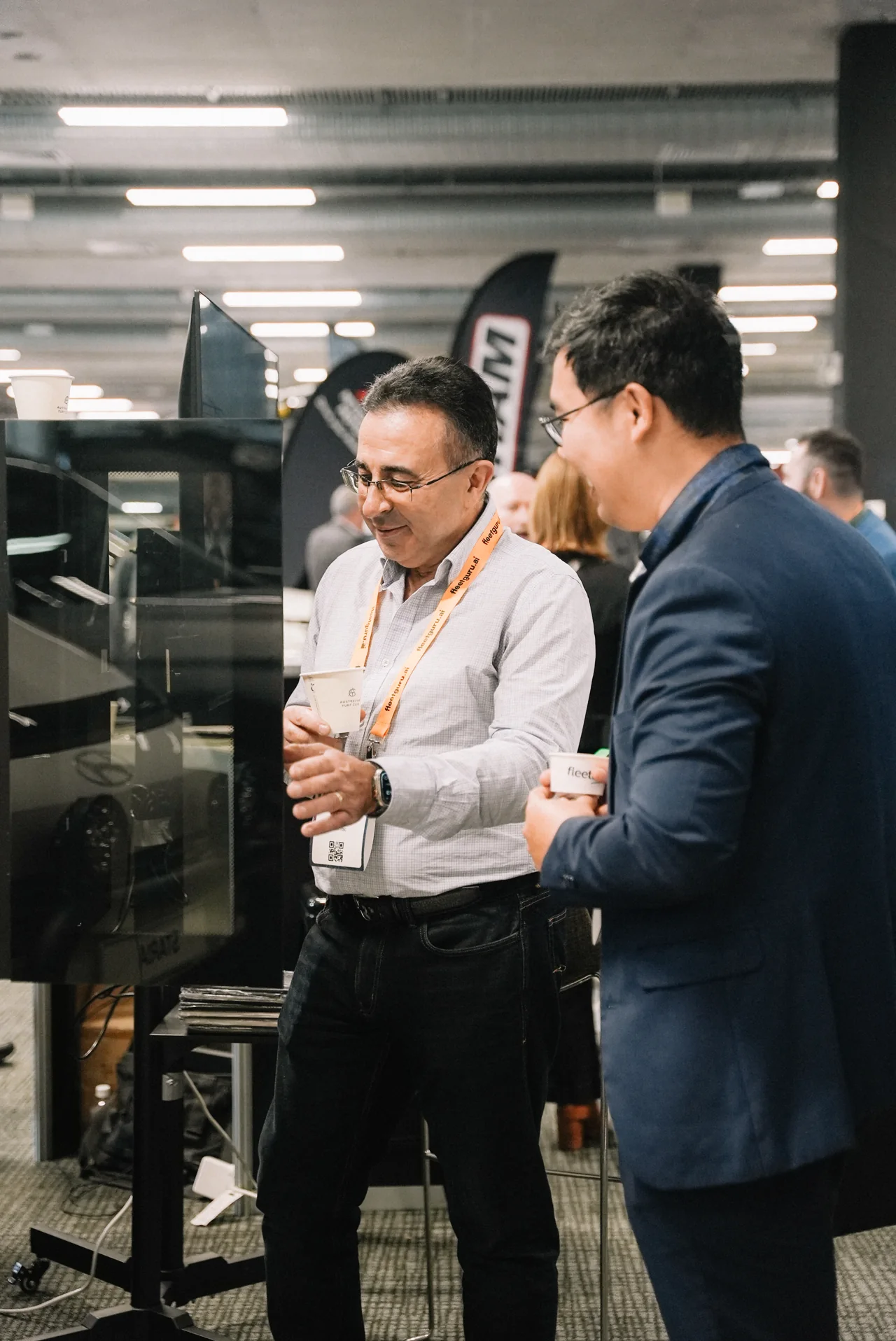 Attendees explore the IntelliTrac demonstration at AfMA 2026.